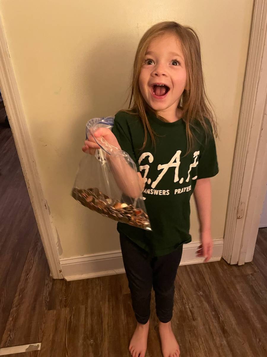 Young Kori with her donation.